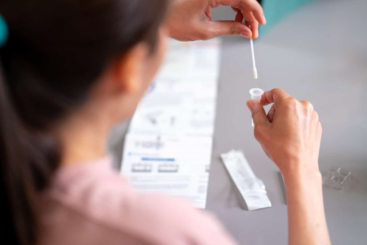 nurse performing common upper respiratory lab tests