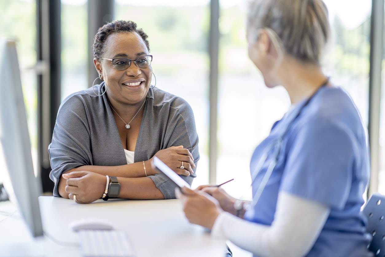 Woman getting a DOT physical exam by a nurse.